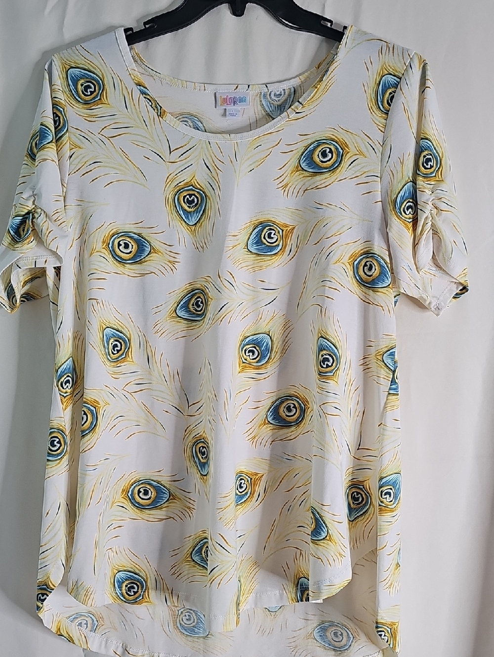 LuLaRoe White Short Sleeve Top with Blue and Gold Peacock Feather Print
